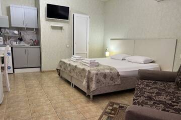 Фото номера Семейные апартаменты с кухней Гостевой дом Galla Hotel г. Адлер 4