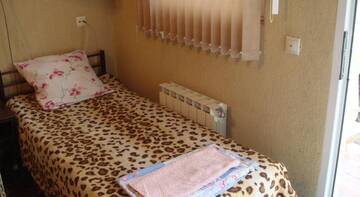 Фото номера Стандартный трехместный номер Гостиница Guest house Atlantik г. Адлер 6
