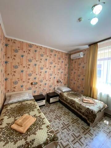 Фото номера Стандартный двухместный номер с 2 отдельными кроватями Гостевой дом Симон г. Адлер 2
