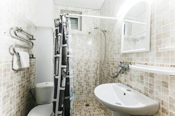 Фото номера Двухместный номер Делюкс с 1 кроватью или 2 отдельными кроватями Гостевой дом У Прибоя г. Адлер 6