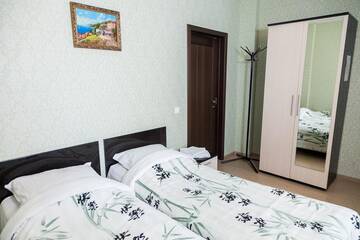 Фото номера Стандартный двухместный номер с 2 отдельными кроватями или двуспальная кровать Гостевой дом Инесса г. Адлер 6